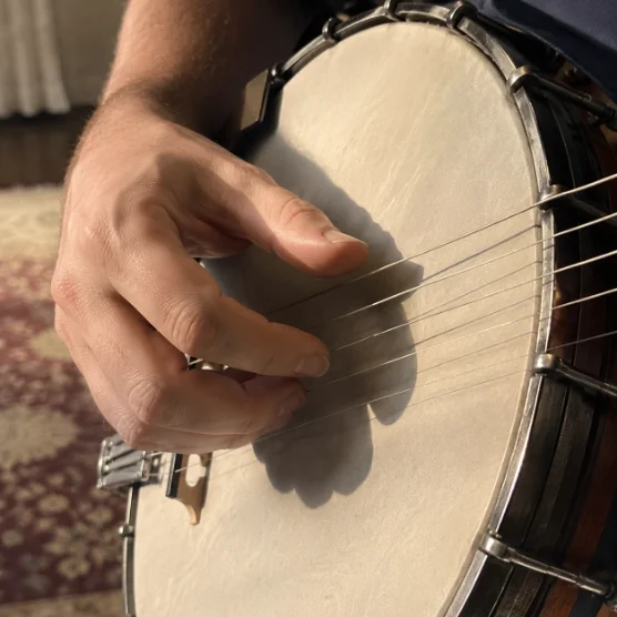 Customer photo — banjo and printed pages